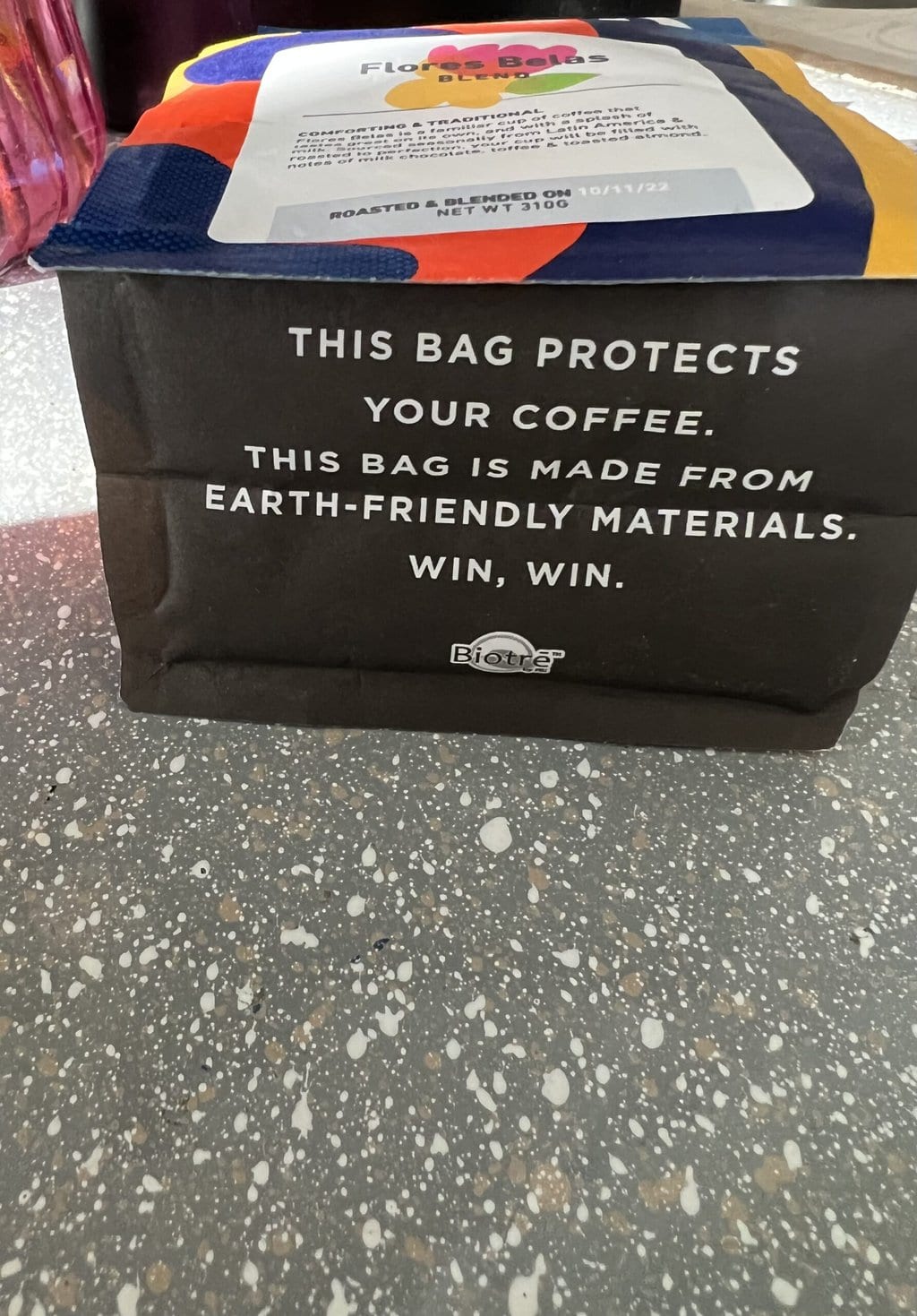 The underside of a Huck Coffee pack with written text stating that the packaging is made from eco-friendly materials