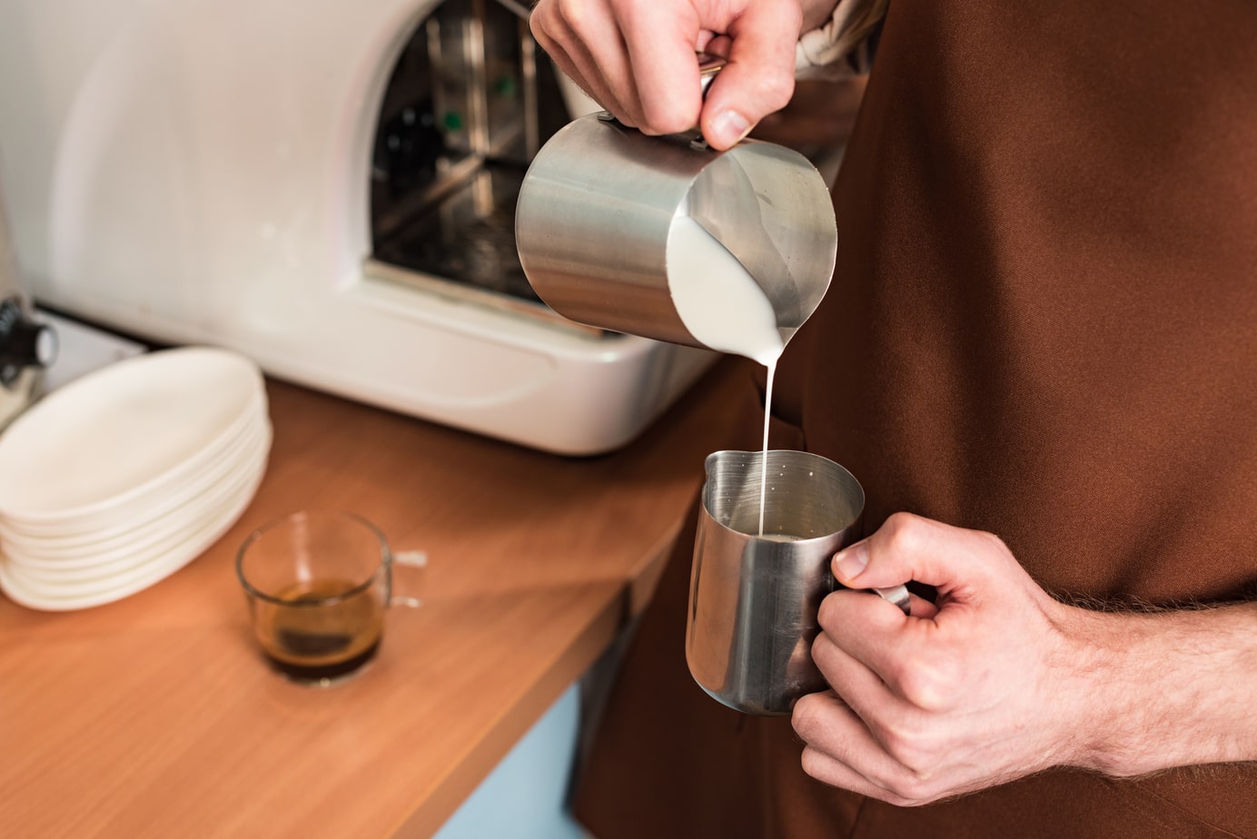 Pouring milk into the cup